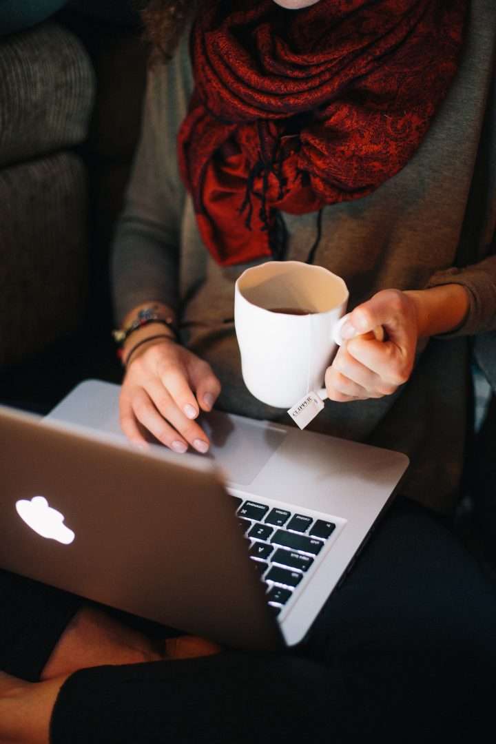 Employee or Independent Contractor: Why It Matters? working at a laptop
