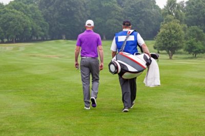 Caddie and golfer