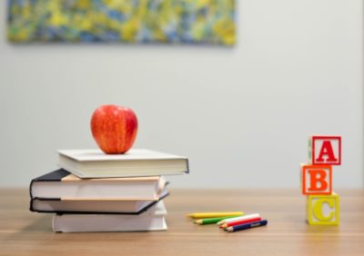 apple on teachers desk and abc
