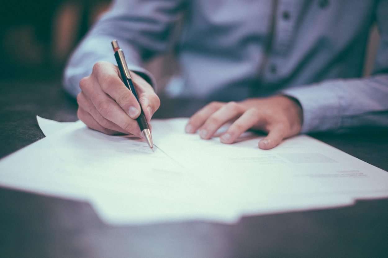 Enforceability of an Arbitration Clause in an Employment Contract man signing a contract