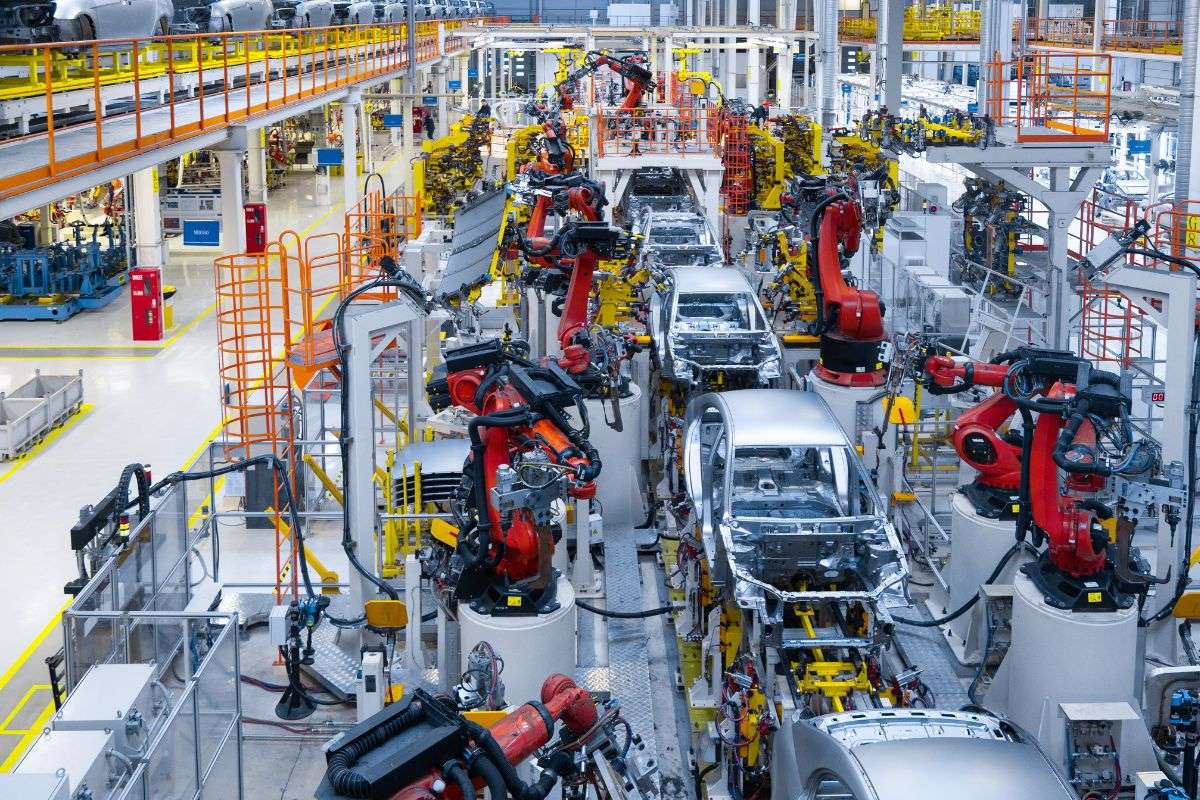manufacturing cars in an assembly line