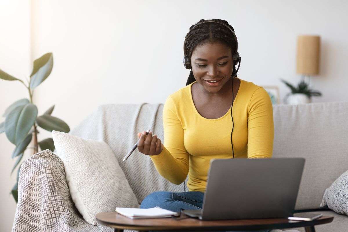 Washington DC Attorney General Settles with Gig Customer Service Firm for Misclassifying Workers woman with headset at home on her couch